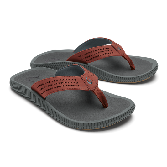 Pair of gray thong sandals with rust-colored perforated straps and textured soles.