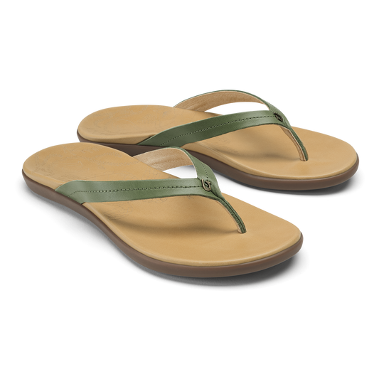 Pair of flip-flop sandals with golden sand footbeds and green olive straps.