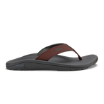 Flip-flop with gray foam sole and brown leather thong strap, side view.
