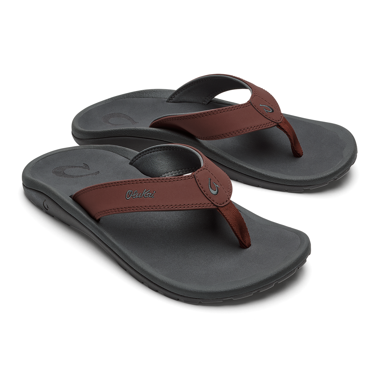 Pair of charcoal flip-flops with burgundy leather straps and curved arch support footbeds.