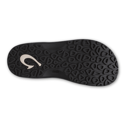 Black sole with geometric tread pattern and white curved logo detail.