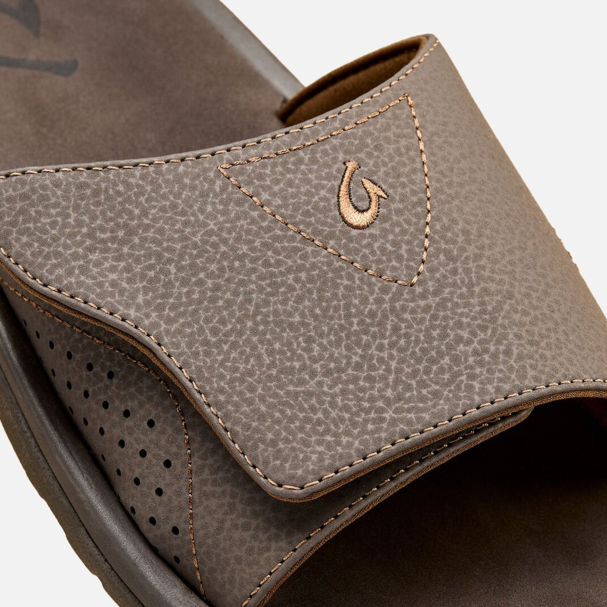 Dark Java leather slide with textured upper, contrasting stitching, and perforated vamp detail.