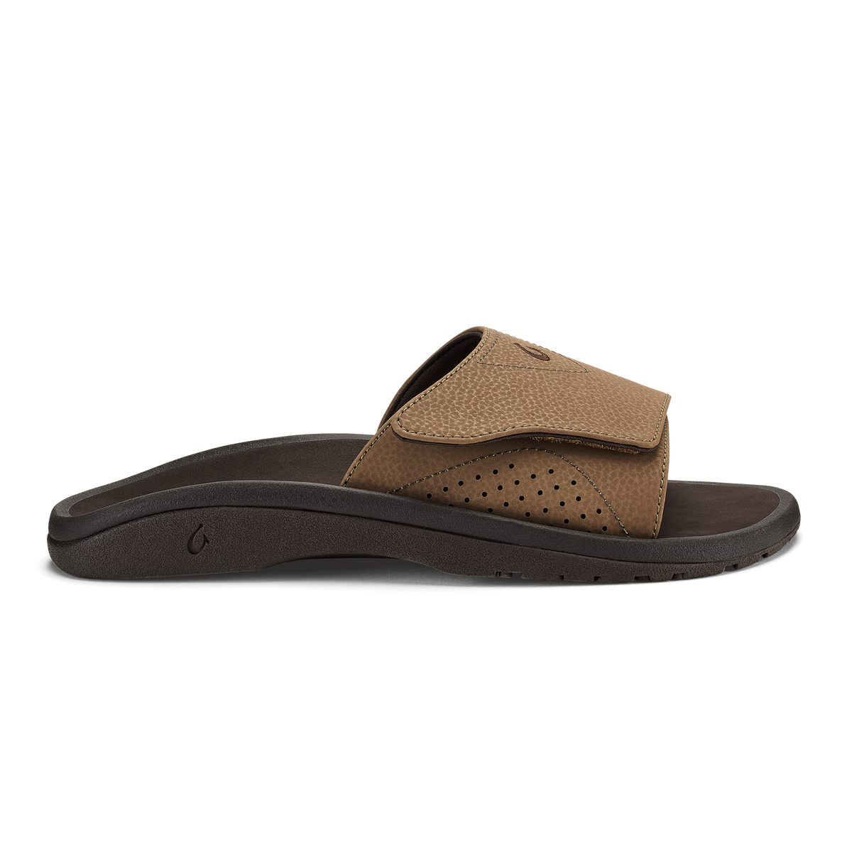Tan and dark brown slide sandal with perforated upper and dark sole, shown from the side.