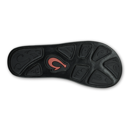Black sole with embossed pattern design and coral-colored logo accent in center.