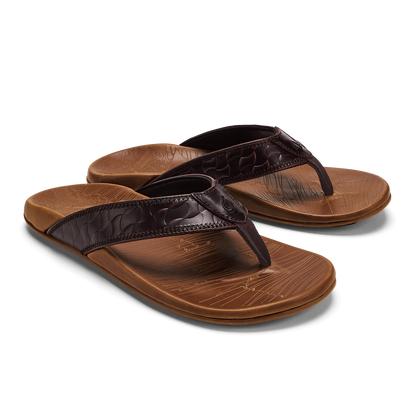 Pair of tan and dark brown flip-flop sandals with textured footbeds and crocodile-embossed straps.