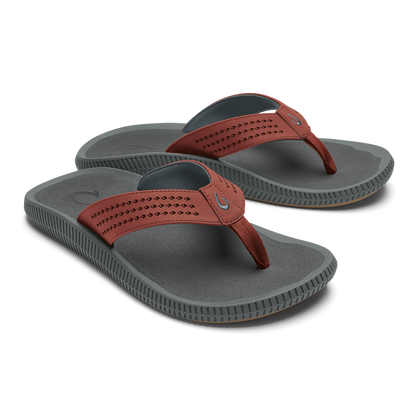Pair of gray thong sandals with rust-colored perforated straps and textured soles.