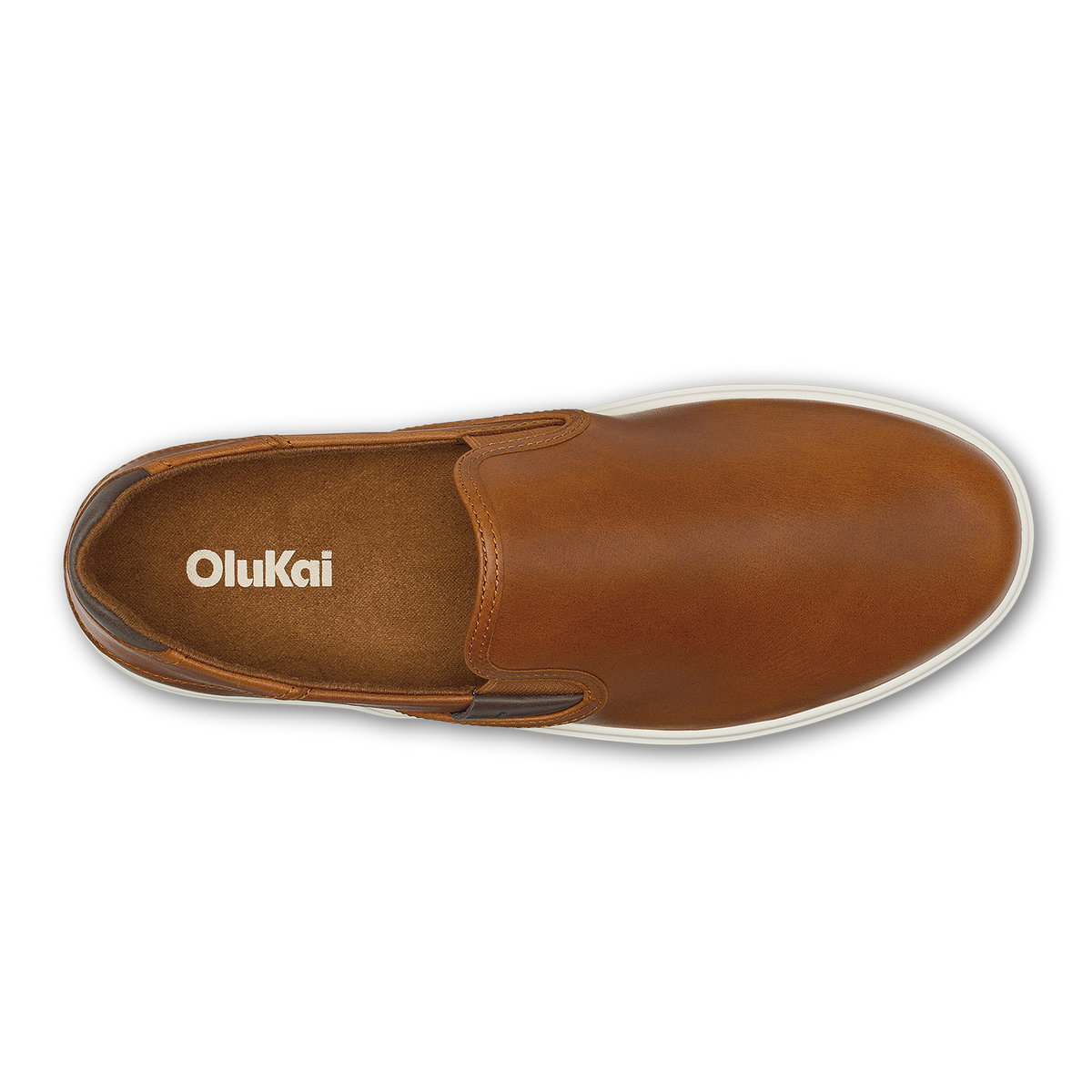 Brown leather slip-on shoe with white sole and OluKai branding visible on insole, top view.