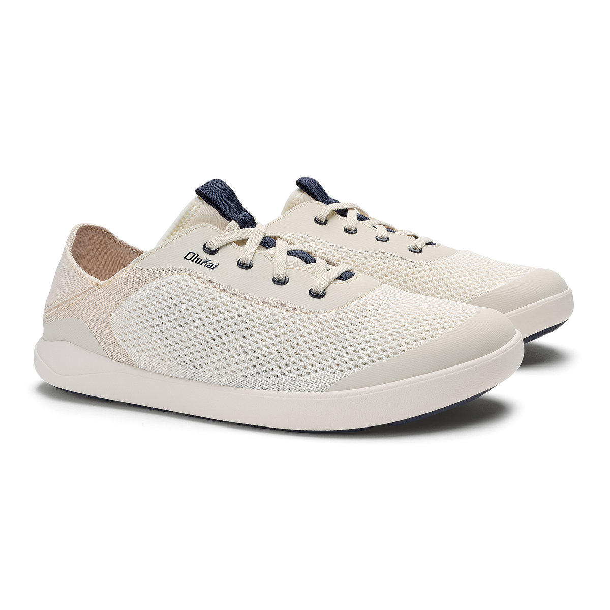 White and navy lace-up sneaker with mesh upper and white sole, shown from the side angle.
