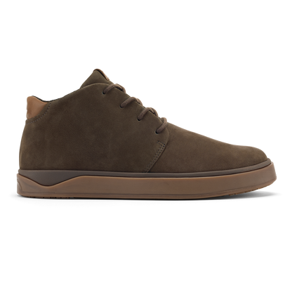 Dark brown suede chukka boot with tan sole and lace-up front closure.