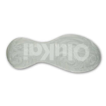 White slip-on shoe sole with curved hourglass shape and ornamental swirl pattern design.