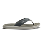 Thong sandal with dark gray upper strap and light gray sole, branded with "Olukai" text.