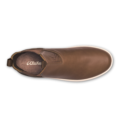 Brown leather slip-on boot with white sole and pull tab, viewed from above.