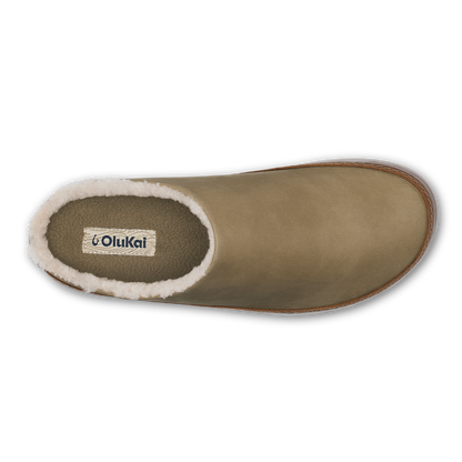 Tan slip-on slipper boot with sherpa lining, shown from above with OluKai branding visible inside.
