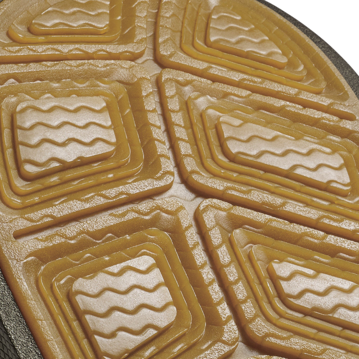 Brown koa wood carving with concentric rectangular frames and wavy line details throughout.