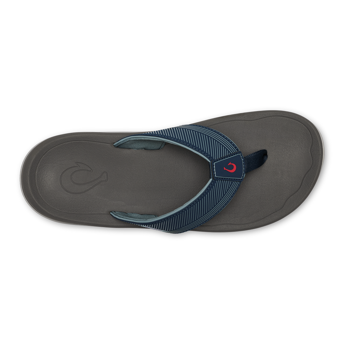 Dark gray thong sandal with blue striped webbing strap and red accent logo on the footbed, shown from above.