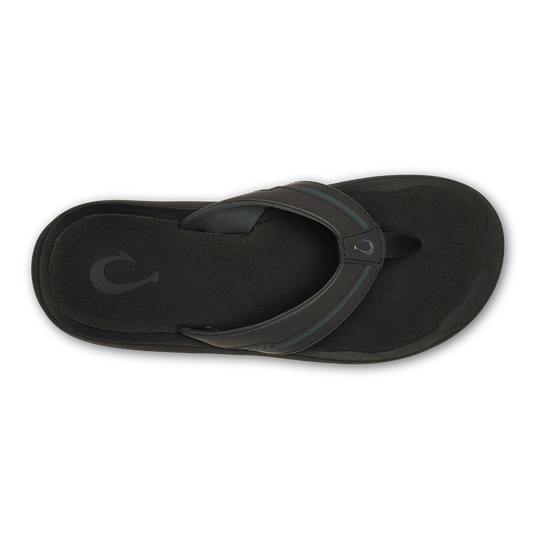Black thong sandal with textured sole and curved leather toe post, shown from above.