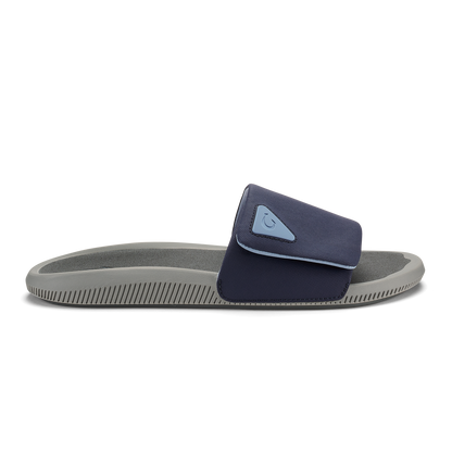 Blue and charcoal slide sandal with gray sole and textured footbed.