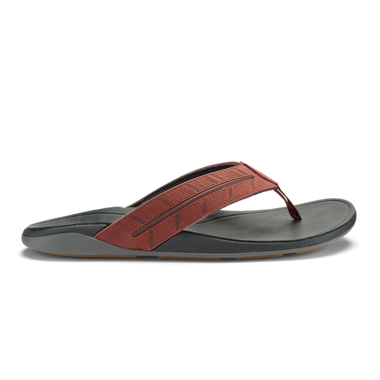 Rust and charcoal thong sandal with textured upper strap and gray molded footbed.