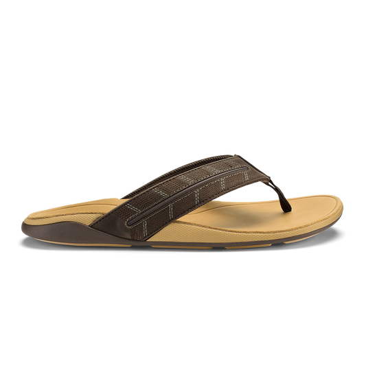 Dark brown and tan thong sandal with textured upper strap and cushioned sole.
