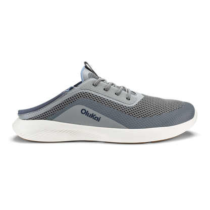 Charcoal and sharkskin slip-on running shoe with mesh upper, white sole, and Olukai branding on the side.