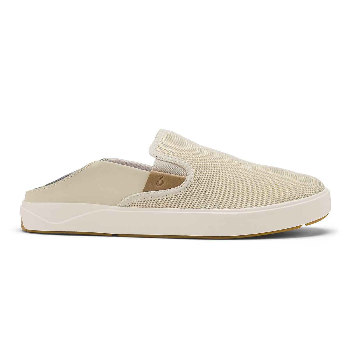 Tan slip-on mule with textured upper, cream sole, and gum rubber outsole.