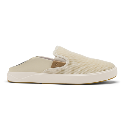 Tan slip-on mule with textured upper, cream sole, and gum rubber outsole.