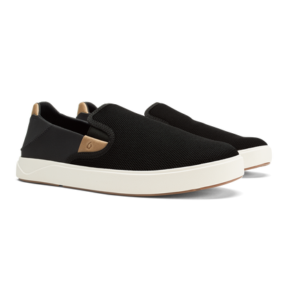 Black slip-on sneaker with tan heel panel and white sole.