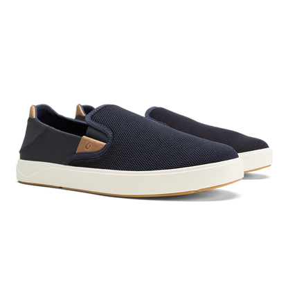 Navy slip-on sneaker with tan heel tab and cream platform sole.