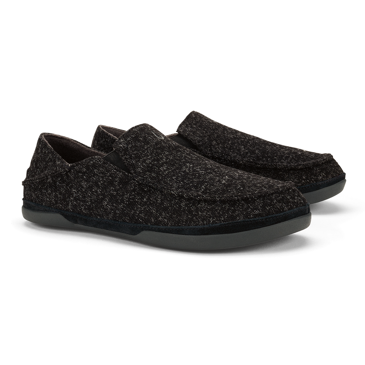 Black textured slip-on loafers with thick rubber soles, shown from the side.