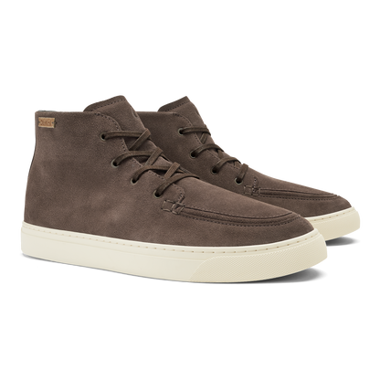 Dark brown suede chukka boots with cream rubber sole and lace-up closure.
