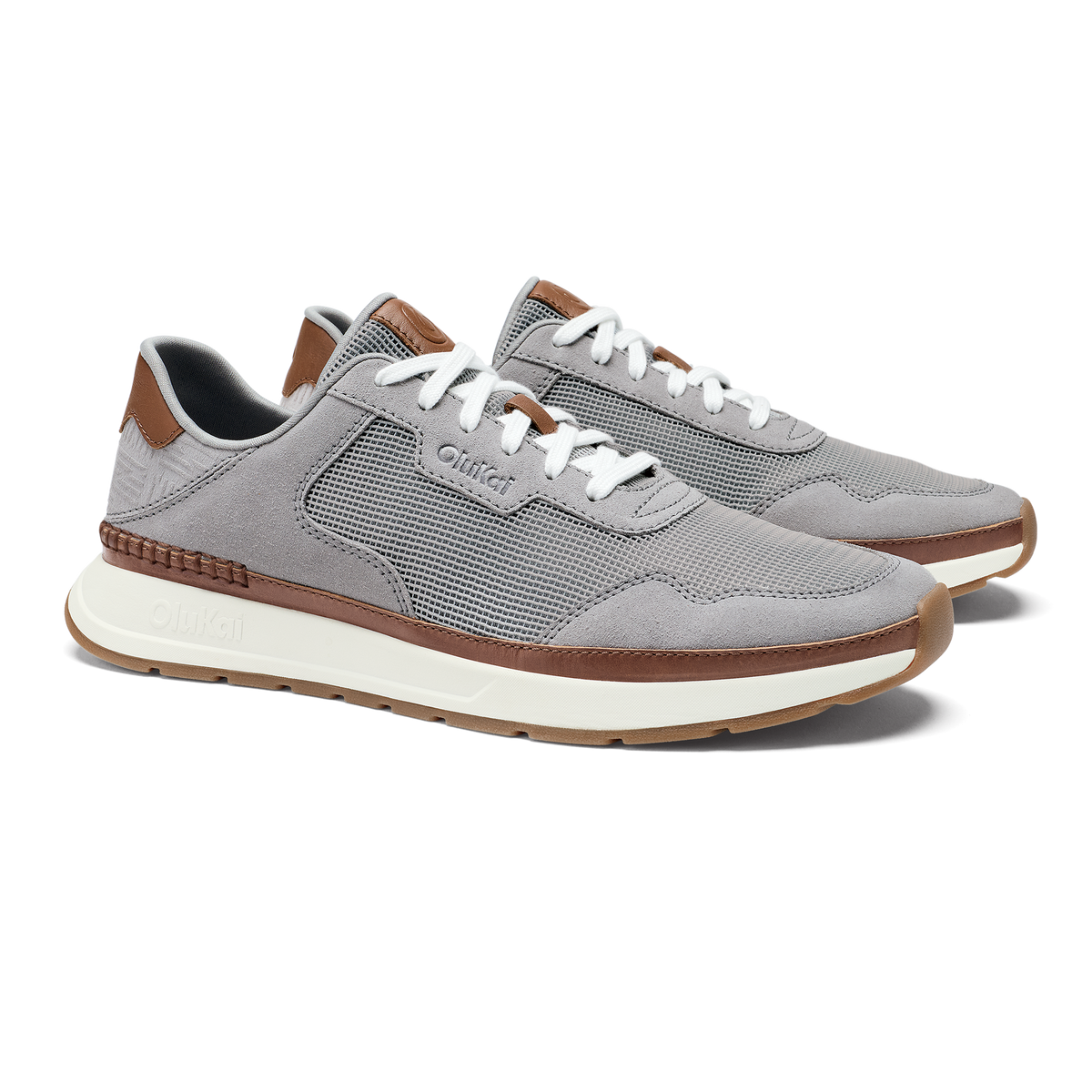Light grey mesh and suede sneaker with brown leather trim and white laces, displayed from the side angle.