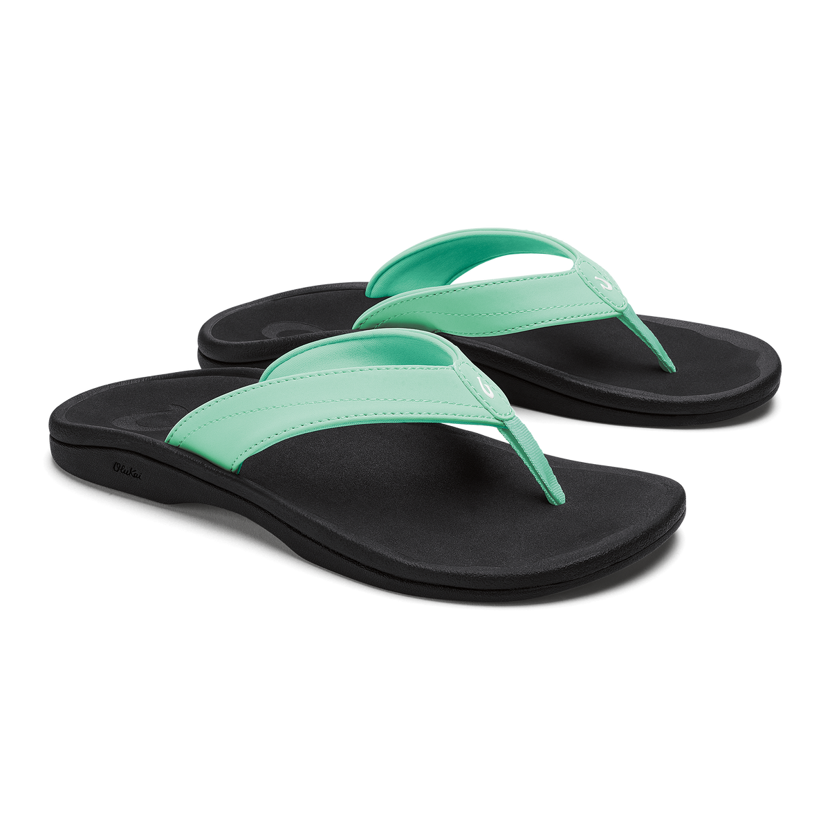 Pair of flip-flops with mint green straps and black footbeds.
