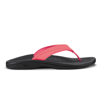 Hot pink and black thong sandal with curved black sole and padded pink strap.