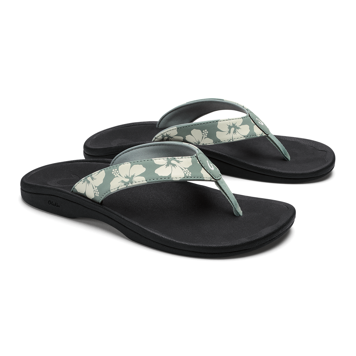 Pair of black thong sandals with silver pine and cream floral patterned straps.