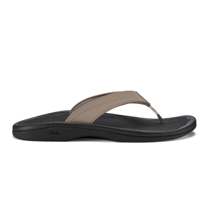 Warm taupe and black thong sandal with curved black sole and stitched toe strap.