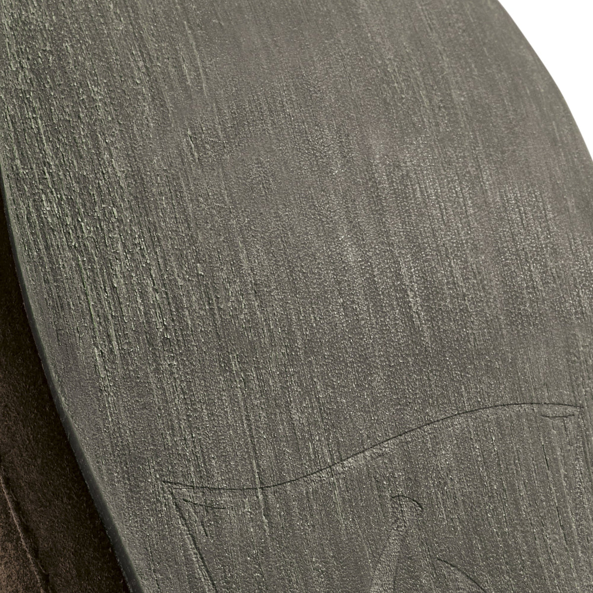Dark oak slipper with textured fabric upper and curved design detail.