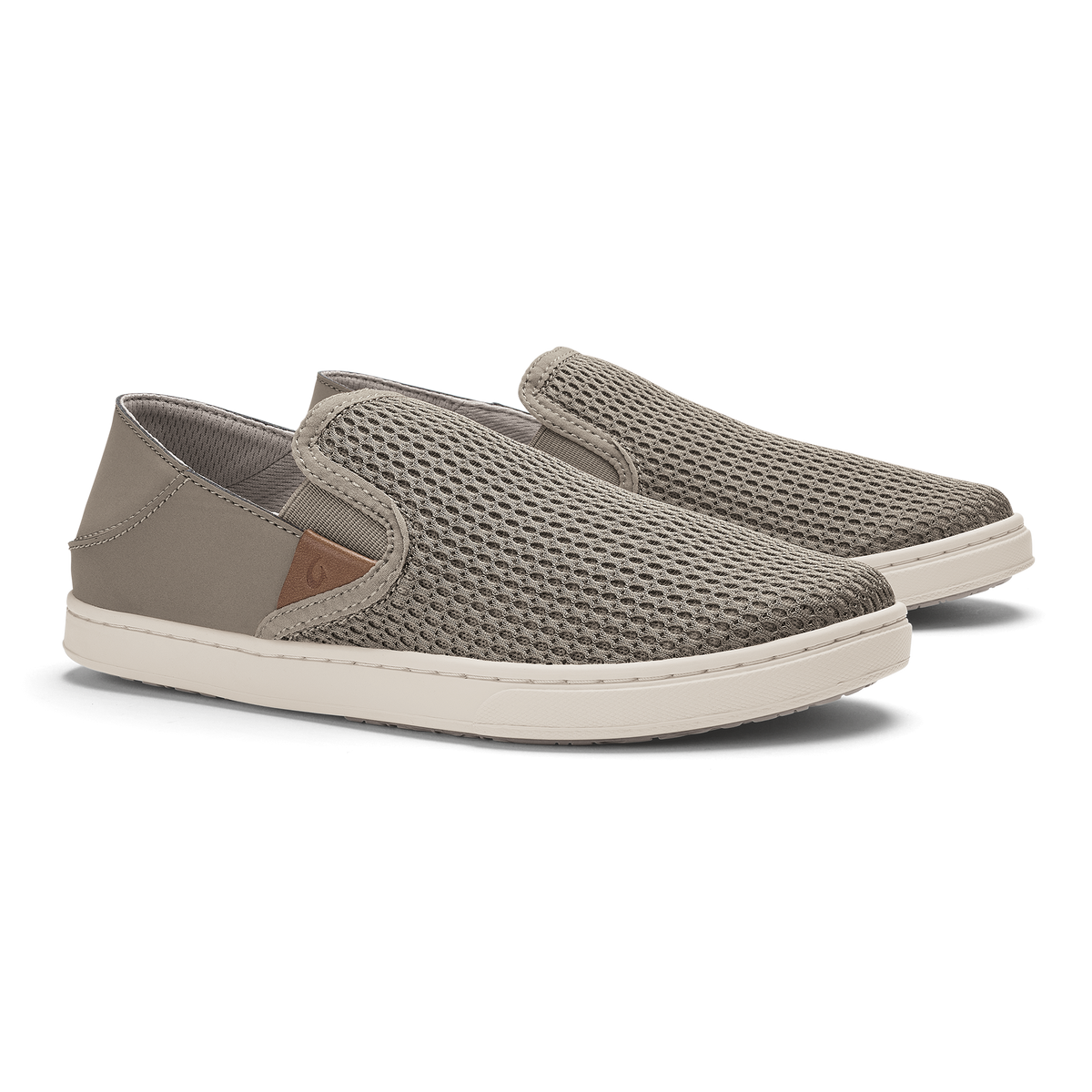 Taupe grey slip-on shoes with textured mesh upper, cream sole, and brown accent panel on heel.