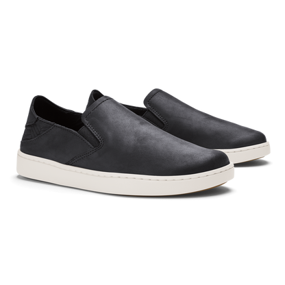 Black leather slip-on shoes with white rubber soles, shown as a pair from the side.