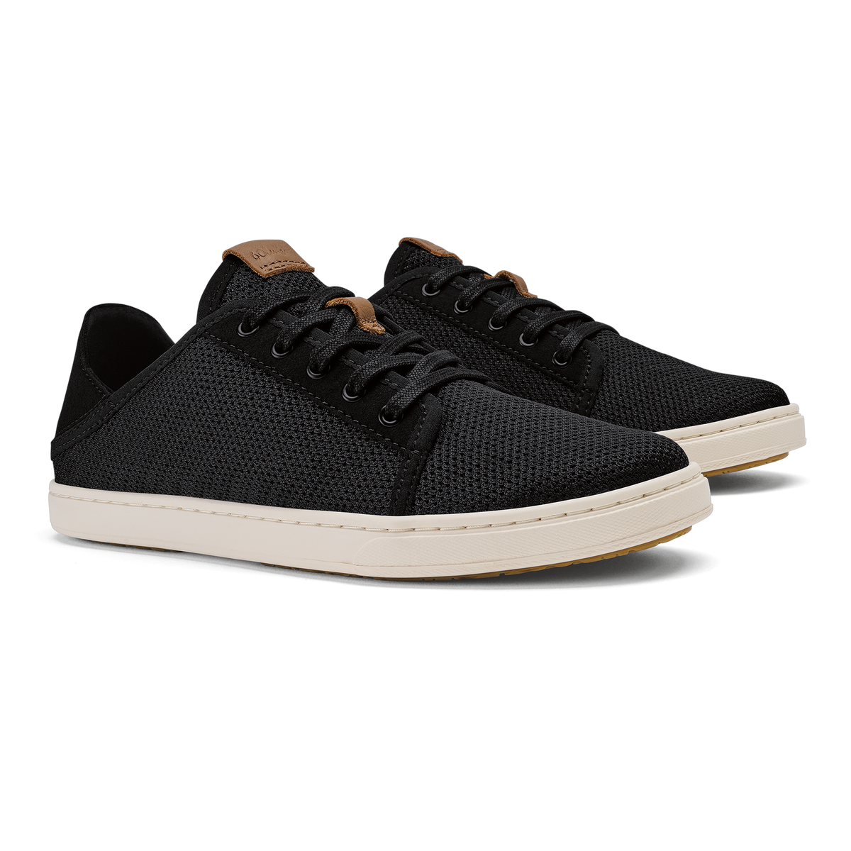 Black knit sneaker with tan collar and cream rubber sole, lace-up closure.