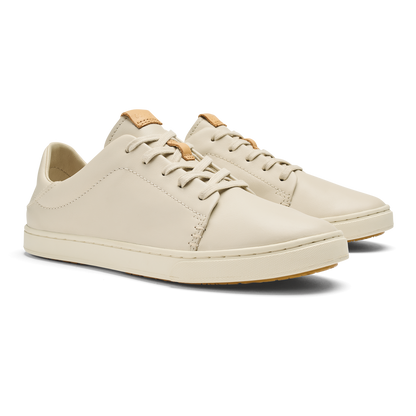 Cream leather lace-up sneaker with tan heel collar and gum rubber sole.