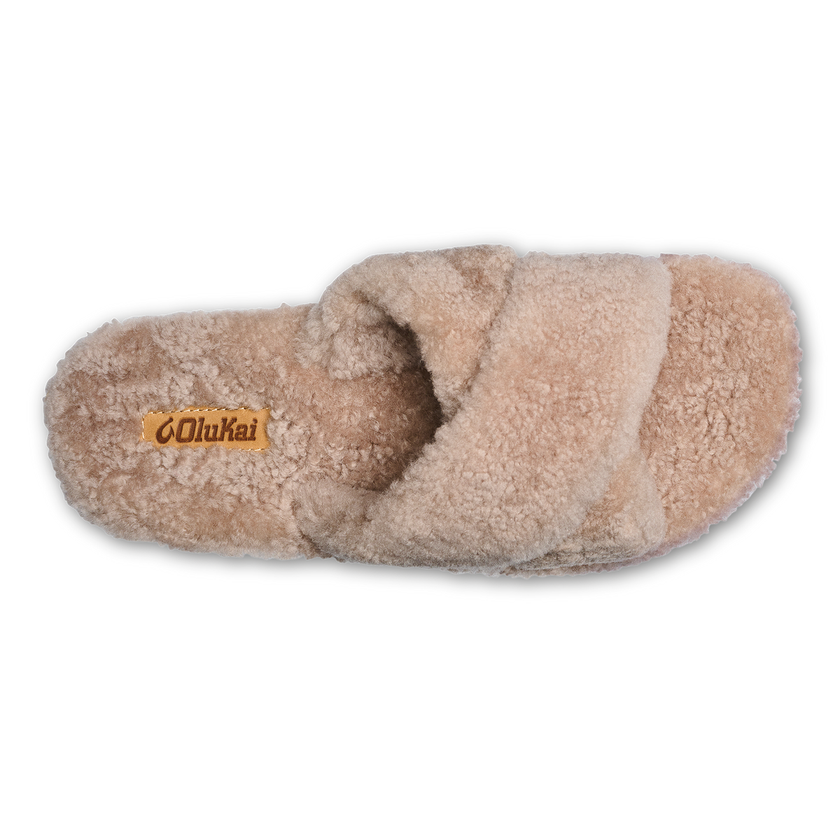 Tan fluffy slipper with cushioned sole and brand label on insole, viewed from above.