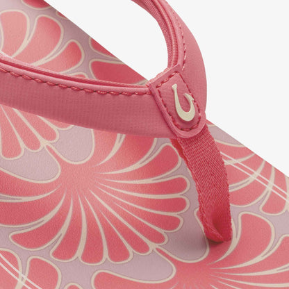 Hot pink shoulder bag with cream shell-pattern design and adjustable handle with closure detail.