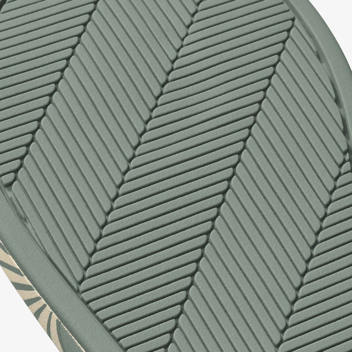 Silver-green cushion with chevron quilted pattern and leaf-shaped design detail.