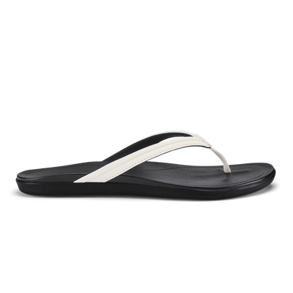 Black flip-flop sandal with bright white thong strap and cushioned footbed.
