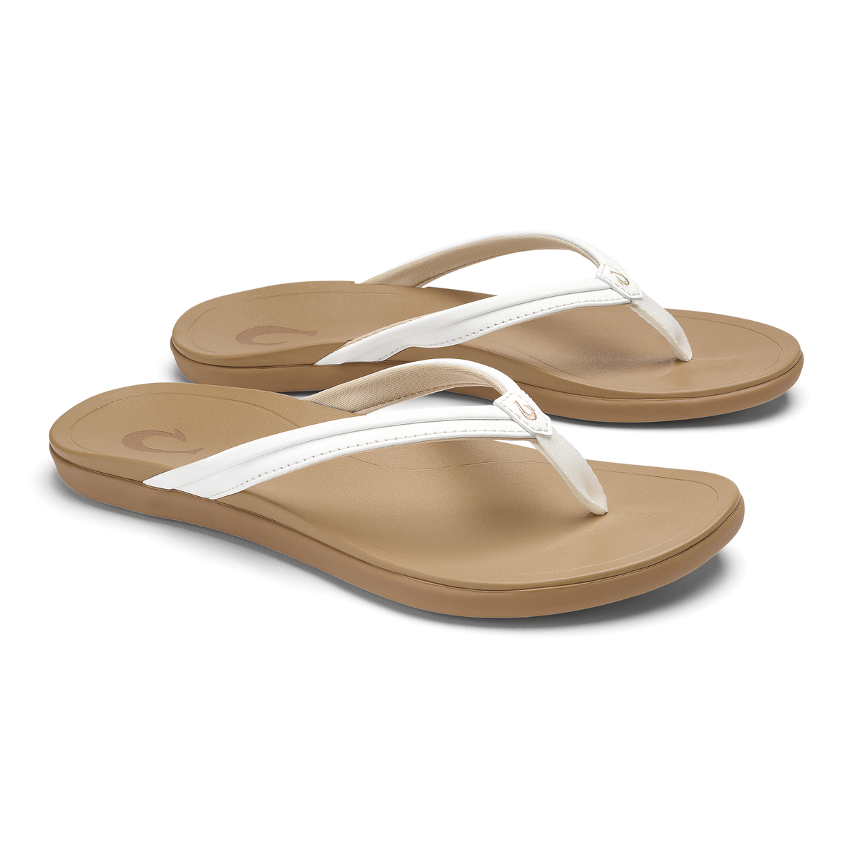 Pair of tan and white thong flip-flops with cushioned footbeds and white straps.
