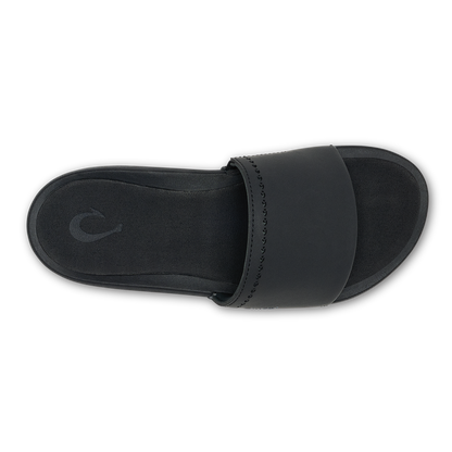 Black slide sandal with padded band across the foot and textured sole, shown from above.