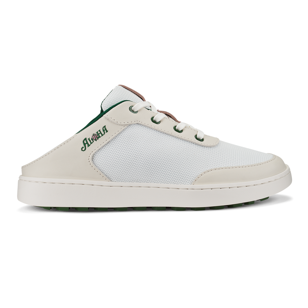 White and cream slip-on mule sneaker with mesh panels, lace-up closure, and dark green heel accent.