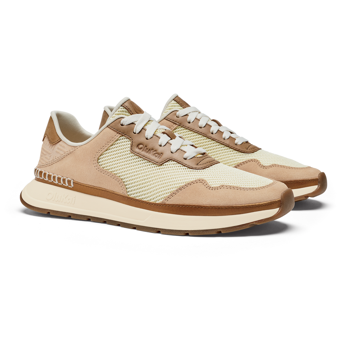 Pair of Koke sneakers with cream and tan mesh and suede upper, white laces, and cream platform sole.