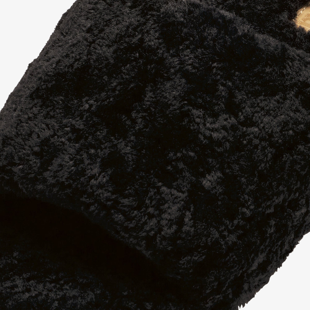Black textured fabric with quilted pattern and gathered construction detail.
