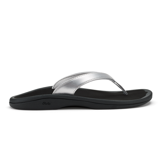 Silver and black thong sandal with curved footbed and metallic upper strap.